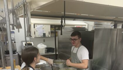Two advanced culinary arts students prepare the all music night meal.