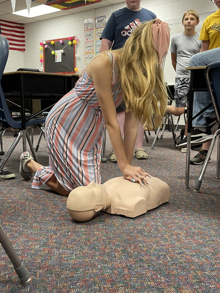 Health student cpr compressions