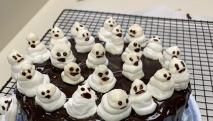 chocolate cake with ghost toppers prepared by foods and nutrition class