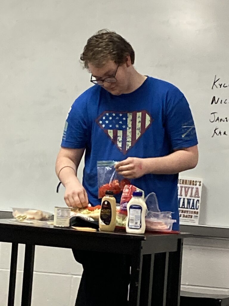 Speech class student shows how to make the perfect sub sandwich