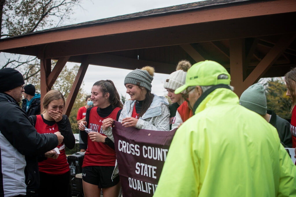 Girls Cross Country Team receives state qualifying banner and medals