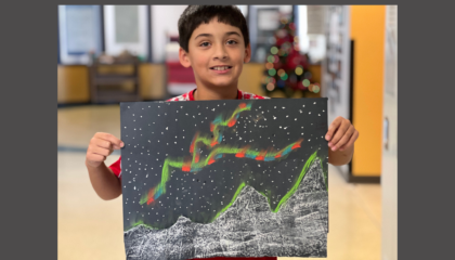 Landon Palmer created a colorful Northern Lights landscape at the STEAM Day art stop.