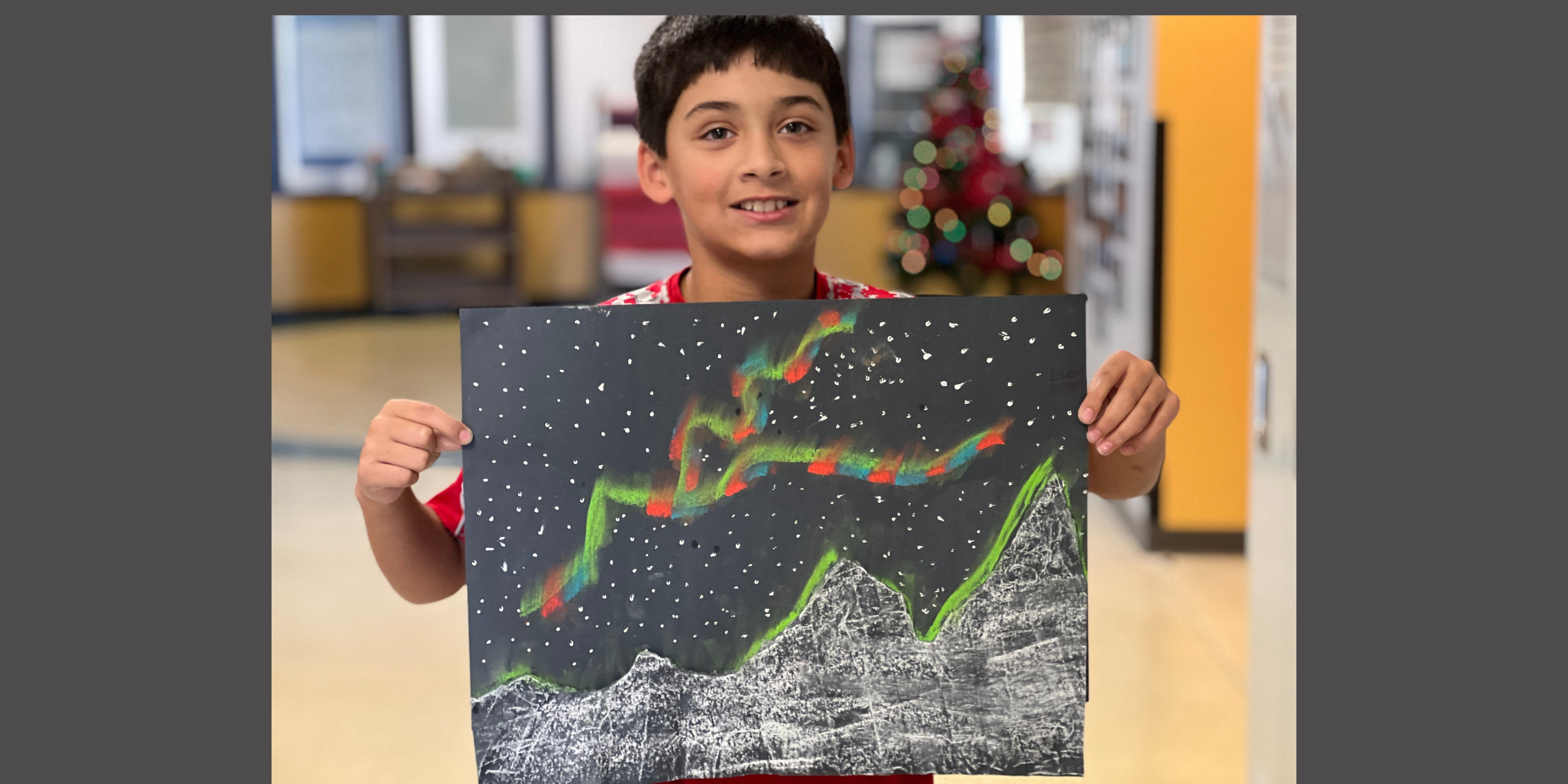 Landon Palmer created a colorful Northern Lights landscape at the STEAM Day art stop.